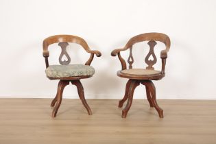 A MATCHED PAIR OF OAK REVOLVING DESK CHAIRS