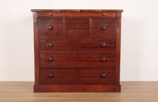 A VICTORIAN FIGURED MAHOGANY CHEST OF DRAWERS