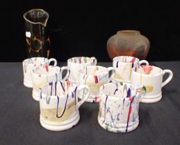EIGHT PAINT SPATTERED SMALL MUGS