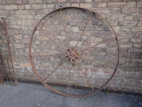 A LARGE IRON WHEEL BY BAMFORDS, UTTOXETER