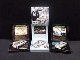 FOUR SCALEXTRIC JAMES BOND CARS