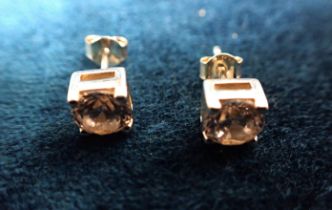 A PAIR OF CUBIC ZIRCONIA STUD EARRINGS