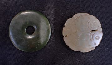 A JADE BI DISC CARVED WITH TWO FISH