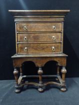 AN EARLY 18th CENTURY STYLE WALNUT CHEST ON STAND