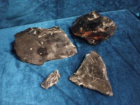 FOUR PIECES OF UNWORKED TURKISH OBSIDIAN