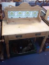 A VICTORIAN STRIPPED PINE WASH STAND WITH ART NOUVEAU TILED BACK