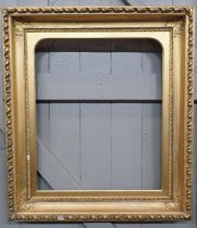 A LARGE 19TH CENTURY GILT GESSO PICTURE FRAME