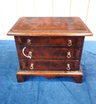 AN EARLY 18th CENTURY STYLE WALNUT MINIATURE CHEST OF DRAWERS