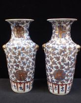 A PAIR OF CHINESE VASES, UNDERGLAZE BLUE WITH 'CLOBBERED' IRON RED
