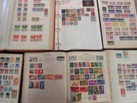 A COLLECTION OF WORLD STAMPS, IN SIX ALBUMS