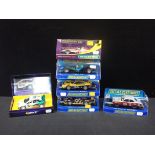 SIX SCALEXTRIC RACING AND RALLY CARS