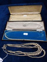 A THREE STRAND PEARL NECKLACES