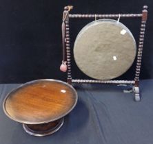 A DINNER GONG ON BOBBIN-TURNED STAND