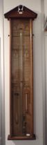 AN OAK-CASED ADMIRAL FITZROY BAROMETER