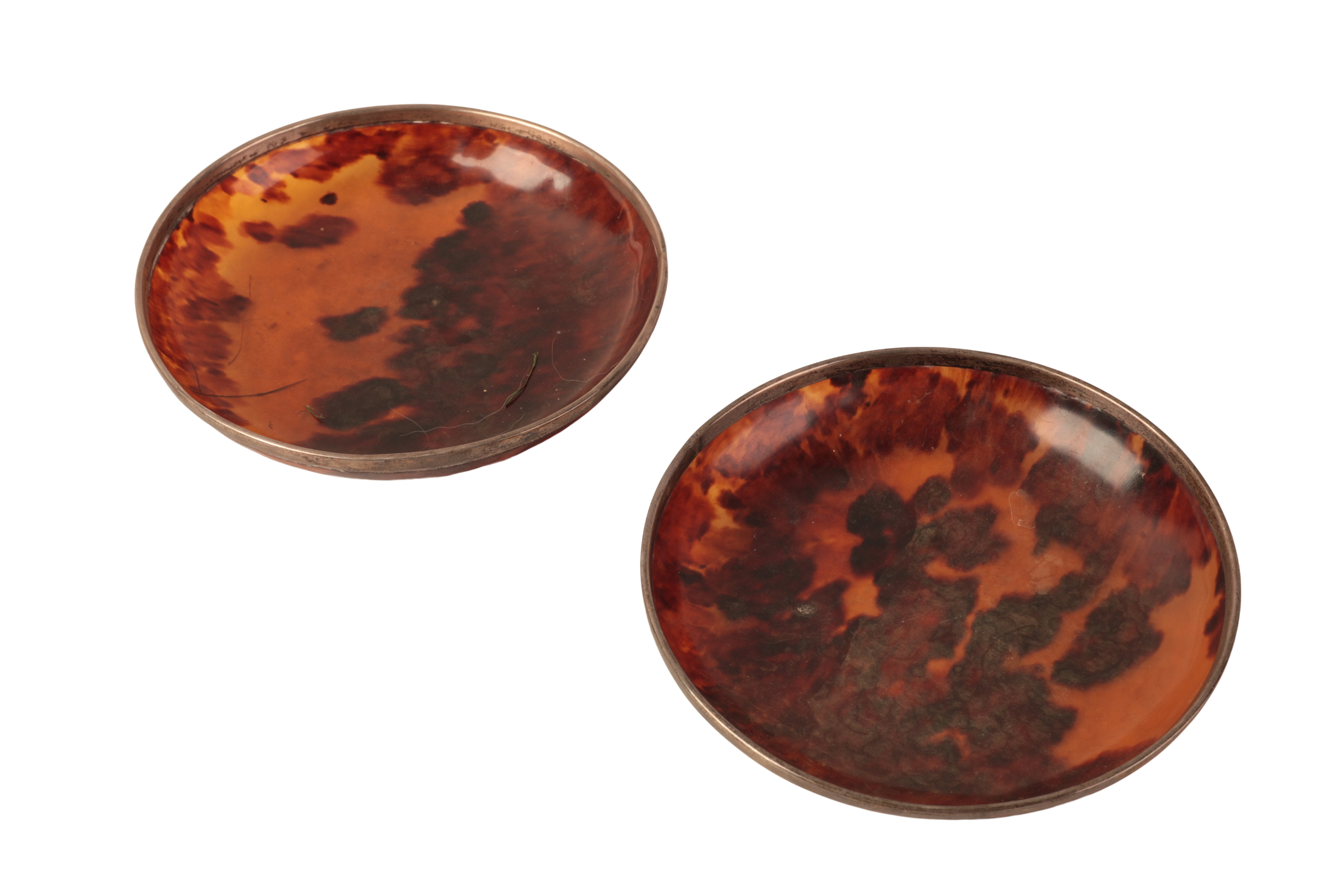 A PAIR OF WHITE METAL MOUNTED TORTOISESHELL DISHES