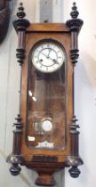 A WALNUT CASED VIENNA STYLE WALL CLOCK