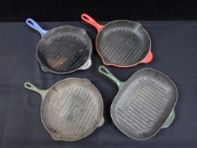 FOUR LE CREUSET GRIDDLE PANS, ONE OVAL