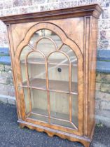 A WILLIAM AND MARY STYLE FIGURED WALNUT TABLE CABINET