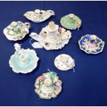 A COLLECTION OF EIGHT EARLY 19TH CENTURY ENGLISH PORCELAIN CHAMBER STICKS