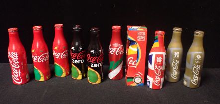 A COLLECTION OF 10 LIMITED EDITION ALUMINIUM COCA COLA BOTTLES