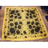 A CHINESE SILK SHAWL, BLACK FLOWERS ON A YELLOW GROUND