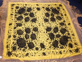 A CHINESE SILK SHAWL, BLACK FLOWERS ON A YELLOW GROUND