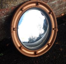 A REGENCY STYLE BALL-FRAMED CONVEX MIRROR