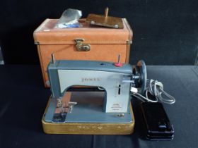 A JONES ELECTRIC SEWING MACHINE