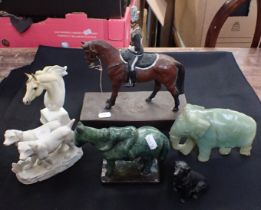 A CAST METAL HORSE AND RIDER