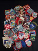 A COLLECTION OF CLOTH BADGES