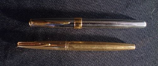 A WATERMAN GOLD PLATED PEN WITH 18K NIB