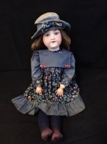 A 19TH CENTURY ARMAND MARSEILLE 390 BISQUE HEADED DOLL