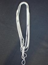 A WHITE METAL MULTI-CHAIN TUBULAR NECKLACE