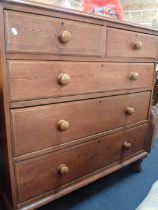 A VICTORIAN STRIPPED PINE CHEST OF DRAWERS