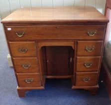 A GEORGE III STYLE MAHOGANY KNEEHOLE DESK