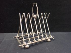 A NOVELTY CROQUET SILVER-PLATED TOAST RACK