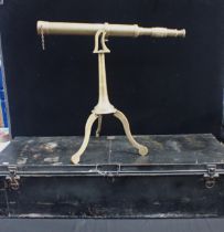 A DECORATIVE BRASS TELESCOPE ON TRIPOD STAND