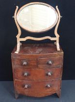 A 19TH CENTURY MINIATURE BOW FRONT CHEST OF DRAWERS