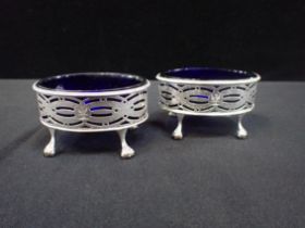 A PAIR OF GEORGE III OVAL SILVER SALTS