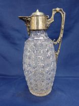 A SILVER-PLATED MOUNTED CLARET JUG