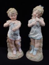 GEBRUDER HEUBACH: A PAIR OF BISQUE FIGURES, BOY AND GIRL