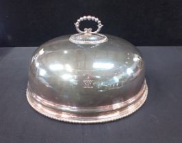 A SILVER-PLATED DISH COVER, WITH ARMORIAL EMBLEM