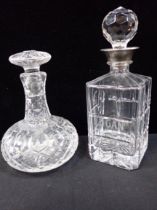 TWO DECANTERS, ONE WITH A SILVER-PLATED COLLAR
