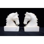 A PAIR OF ALABASTER HORSE'S HEAD BOOKENDS