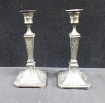 A PAIR OF SPELTER CANDLESTICKS WITH EGYPTIAN REVIVAL MOTIFS