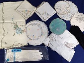 A COLLECTION OF VINTAGE EMBROIDERED TABLE MATS AND NAPKINS