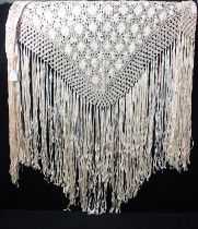 A SHAWL, WOVEN OF FLAT TAPES