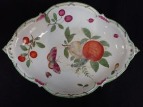 A CHELSEA DISH, PAINTED WITH FRUIT AND BUTTERFLY