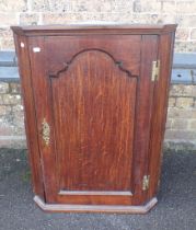 A GEORGE III OAK CORNER CUPBOARD