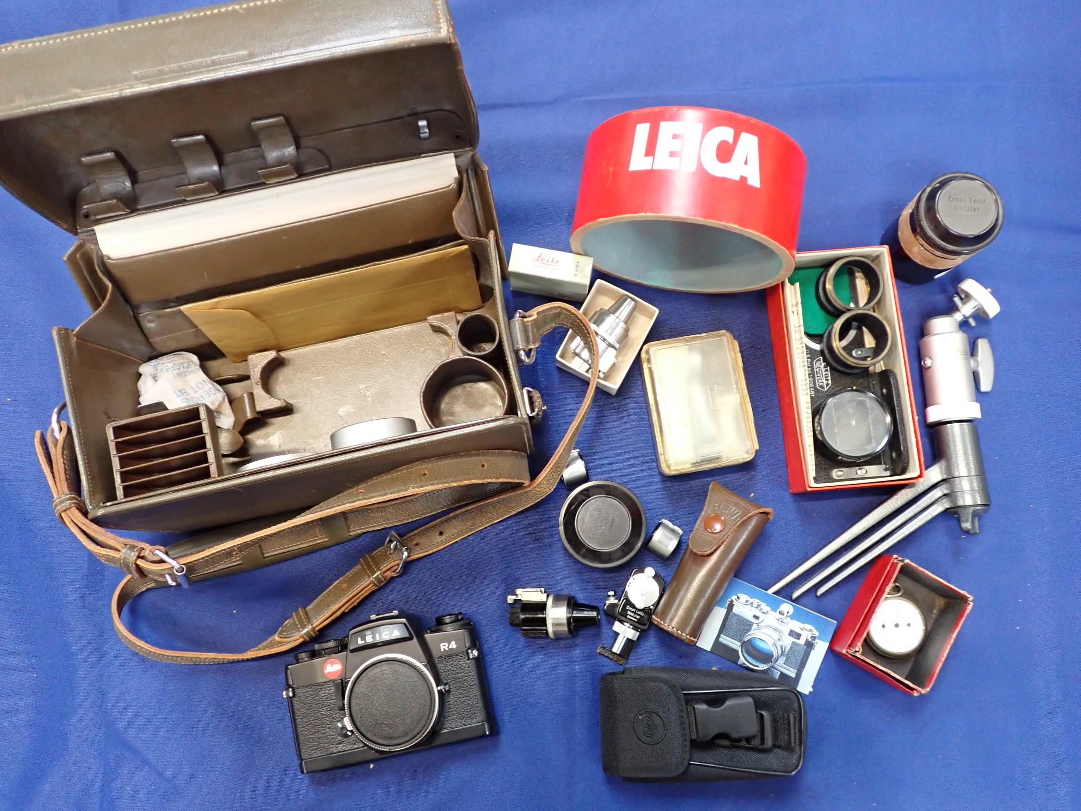 A LEICA R4 CAMERA BODY, IN ASSOCIATED CASE